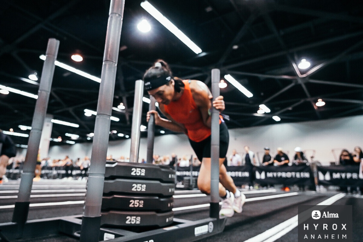 Ayda Page competing in a HYROX-style sled push event